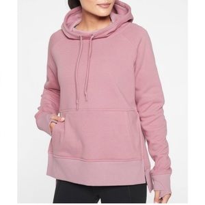- Athleta Woman pink pullover hoodie front pocket, thumbhole and jaw string